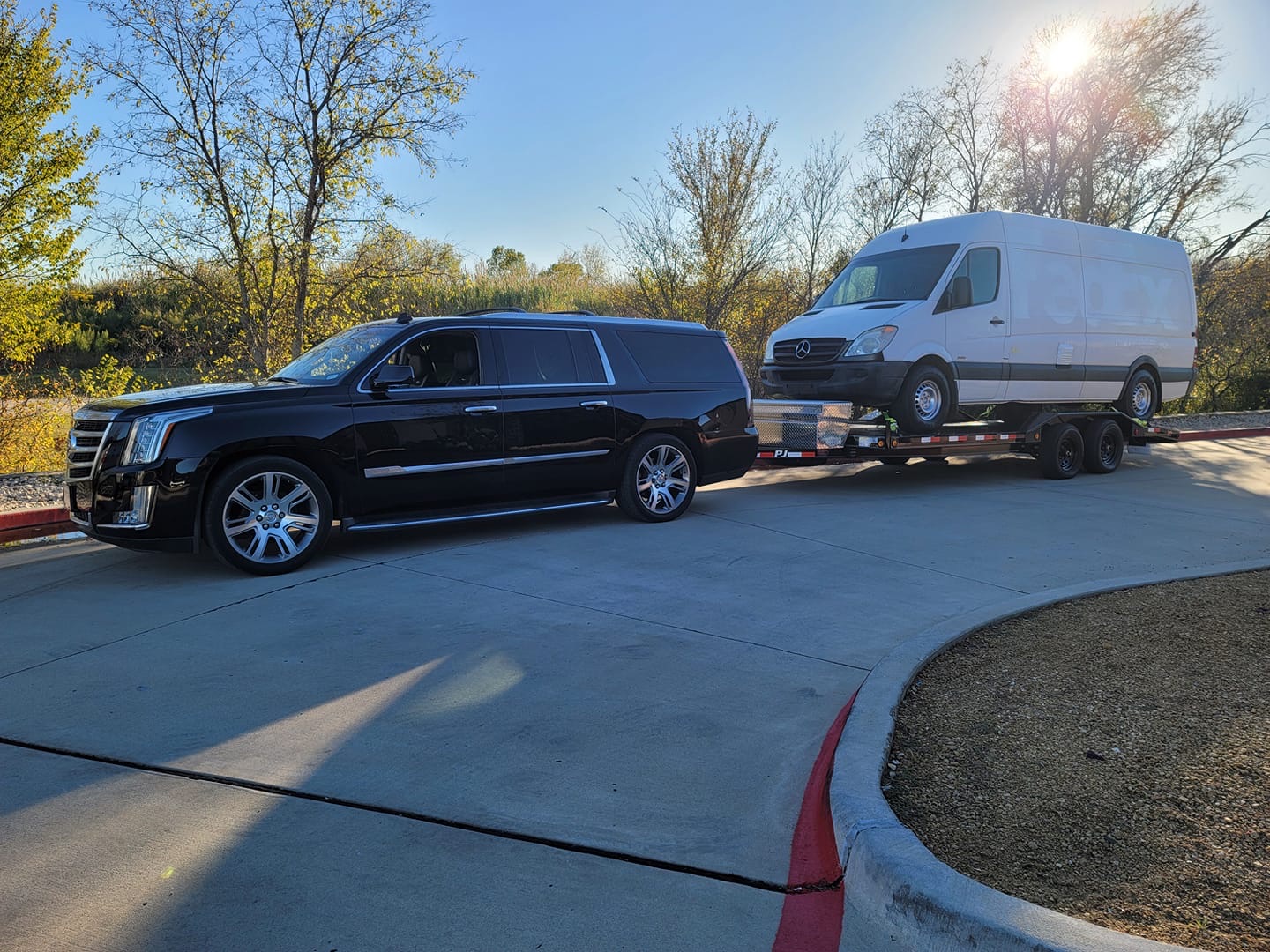 DFW Trailer Rentals — Cadillac Escalade and Sprinter van loaded on car haulers in Garland, TX